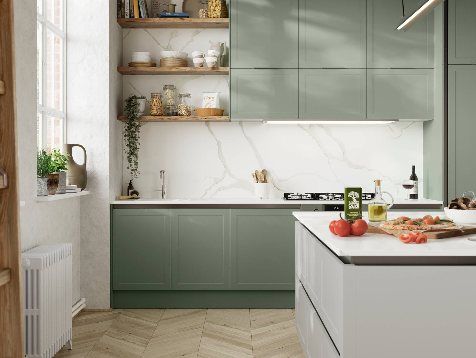 Integra Dunham from Magnet is a handleless shaker frontal, here shown in kitchen with kitchen island and wall cabinets in shades Eucalyptus and Washed Cotton, with a white marbled worktop and matching splashback with wood open wall shelves..