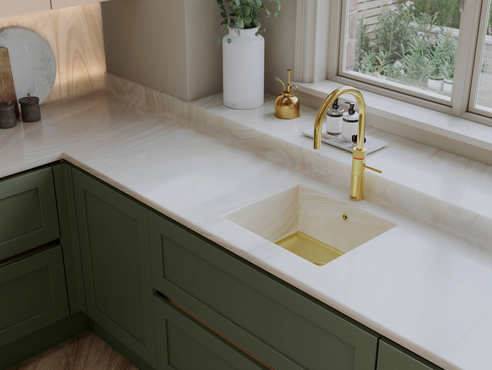 Overhead view of Integra Wardley in shade Misty Moors, with a white worktop and sink, paired with a brss kitchen tap.