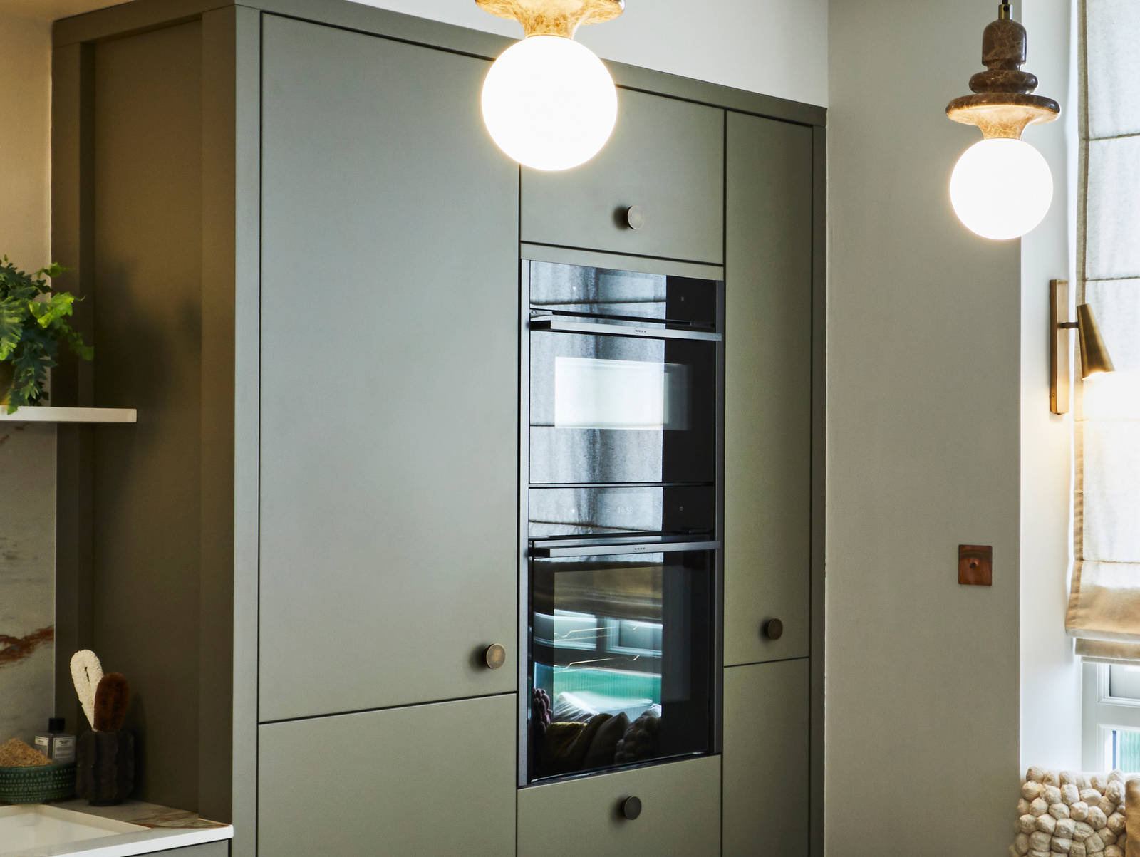 Modern slab Soho cabinets in the Balmoral colour, a soft beige green tone