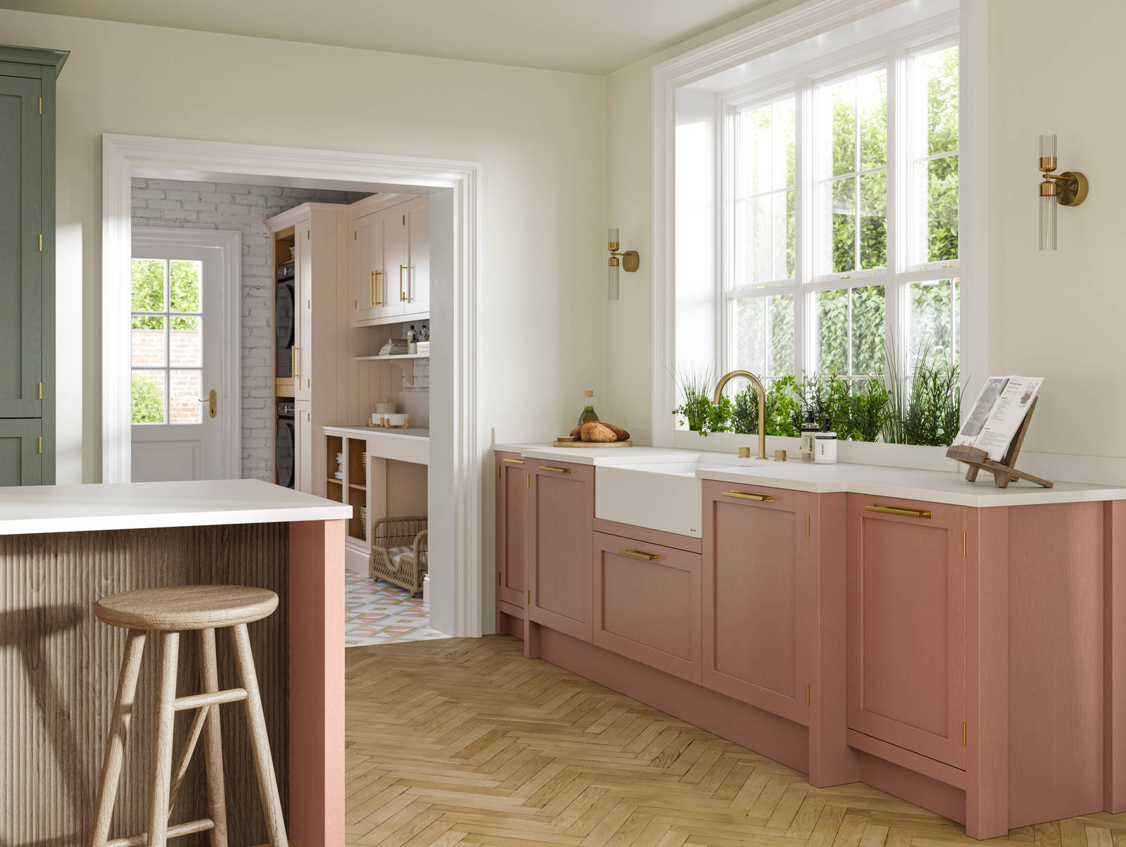 Wardley kitchen cabinetry in shades Clay and Thyme, as well as lighter beige shade Utility room visible through wide archway.