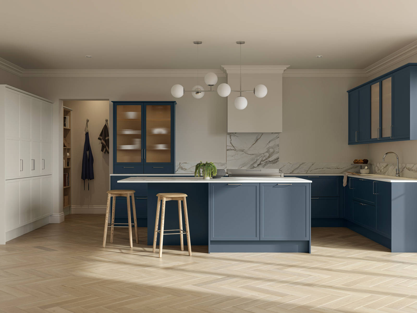 Modern Shaker kitchen Brunswick Voyage blue and Limestone with white and grey marbled worktop and matching splashback, a kitchen island with light wood stools at breakfast bar and vitrine cabinets with fluted glass, light wood herringbone flooring.