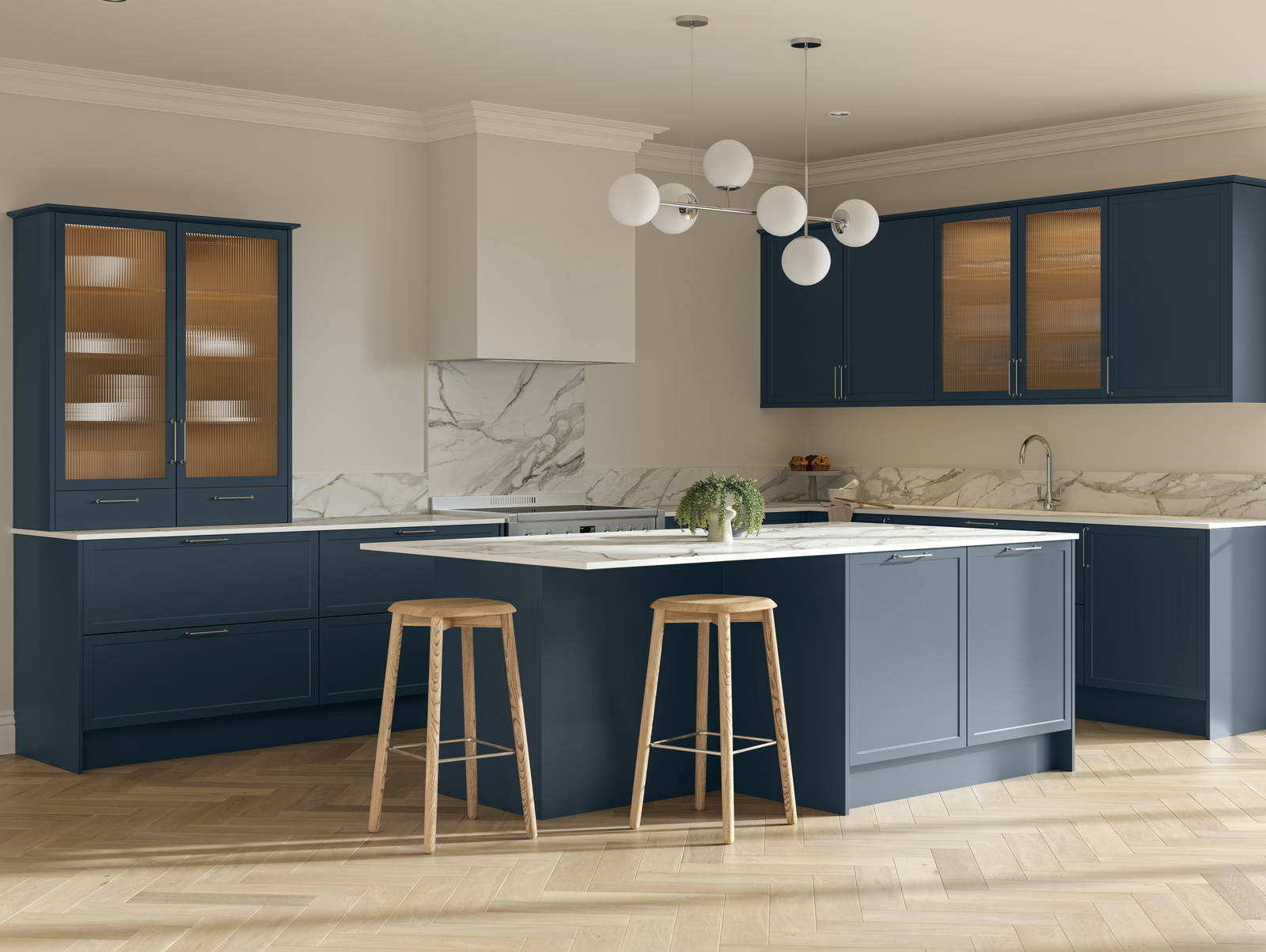 Modern Shaker kitchen Brunswick Voyage blue with white and grey marbled worktop and matching splashback, a kitchen island with breakfast bar and vitrine cabinets with fluted glass, and light wood herringbone flooring.