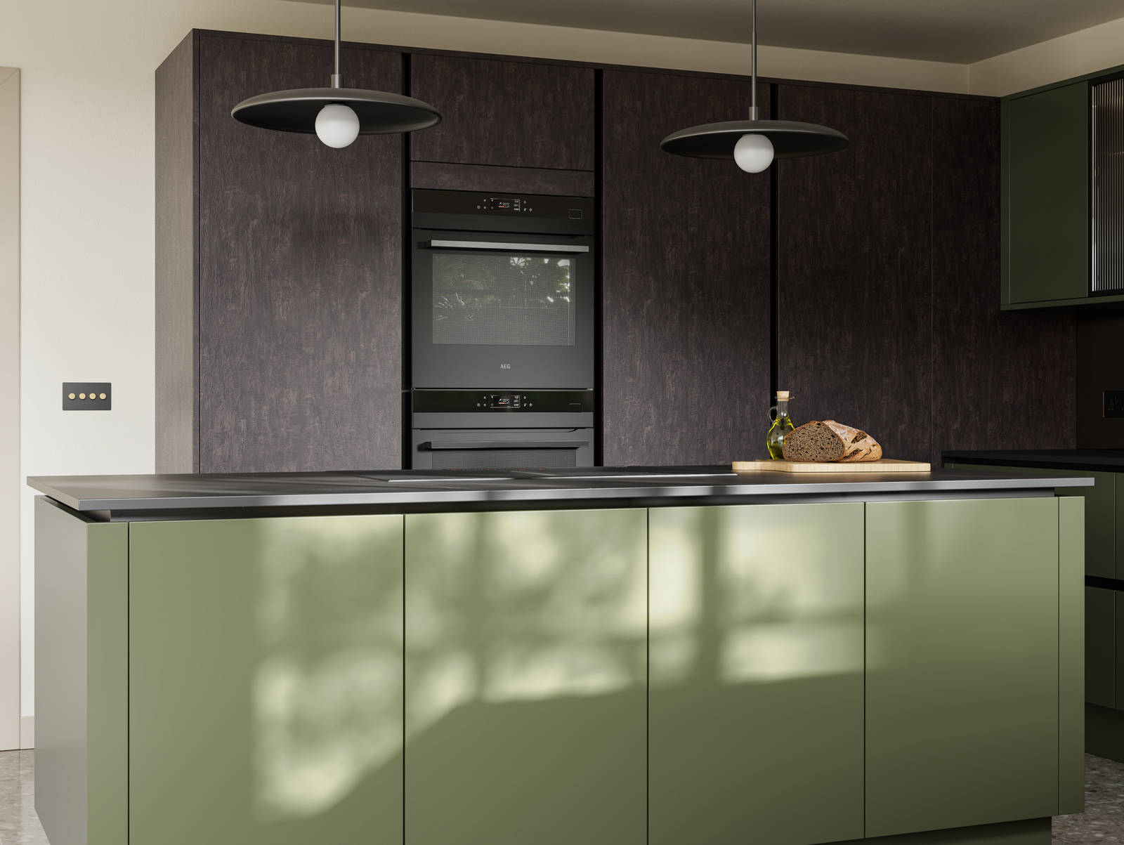 Integra Soho Tailored Green kitchen and kitchen island with contrasting dark wood Portobello Etna and black accessories, integrated ovens in tall cabinets, Dekton worktop and fluted glass vitrin wall cabinets.