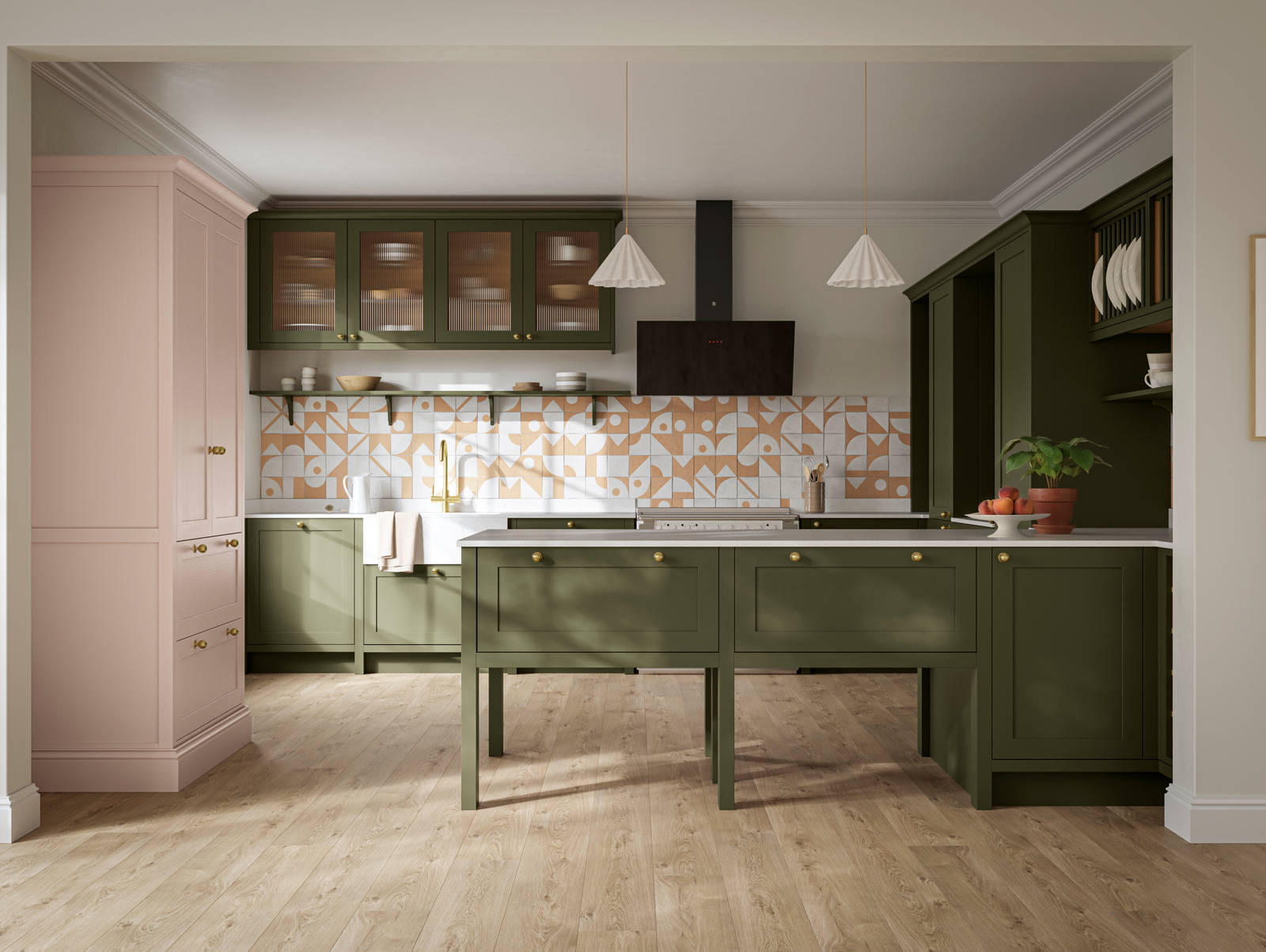 Premium Shaker kitchen Wardley Tailored green with traditional detailing, brass accessories, fluted glass wall vitrine cabinets, standalone Wardley Chalk Blush pantry, Classic Flint Grey oiled oak engineered wood flooring.