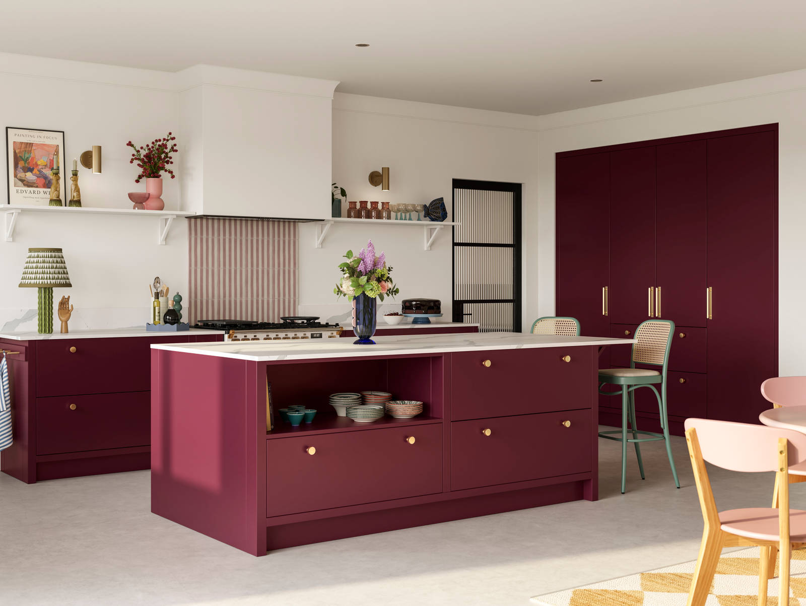 Modern slab front Soho Morello kitchen with built-in tall cabinets hiding integrated refrigerator, kitchen island with rattan bar stools at breakfast bar, Bianco calacatta worktop and upstand, brass knobs and open shelf in kitchen island holding eclectic eramics.