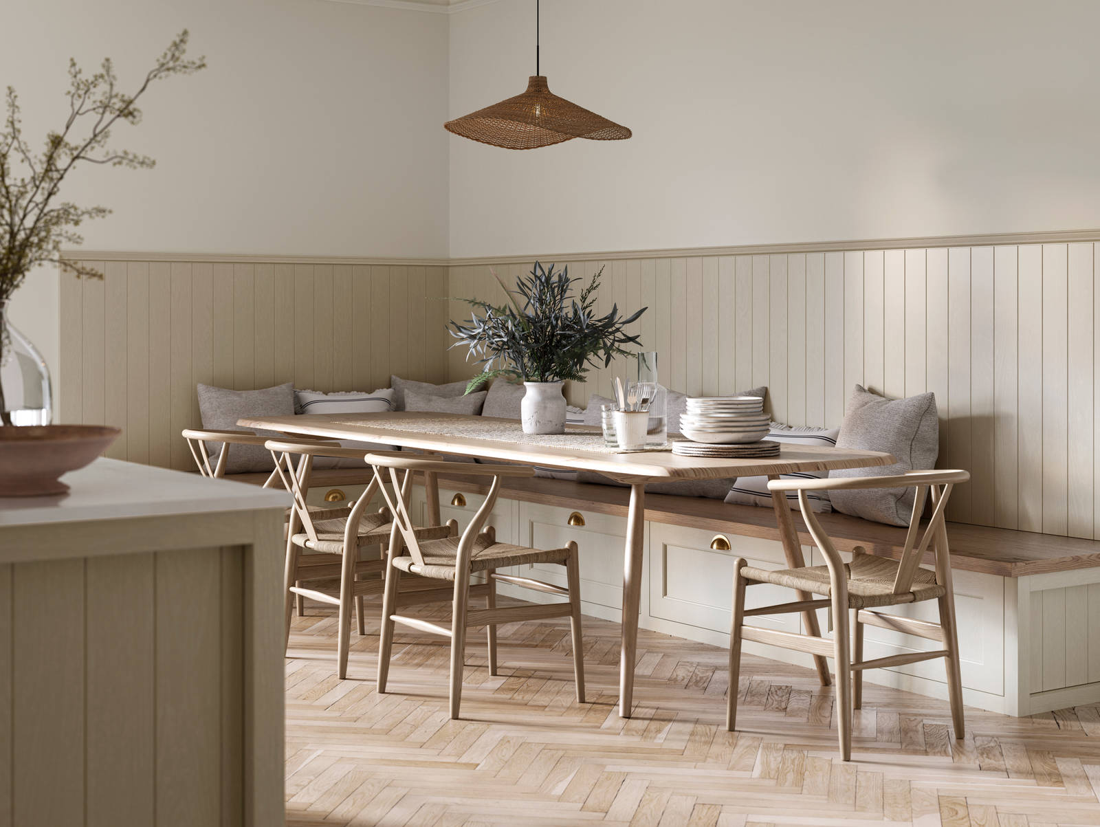 Traditional Shaker-style Ludlow Parchment bench cabinets with tactile woodgrain, a kitchen island and matching wall panel, a long wood diningroom table with matching wood chairs and ceramics set out on the table.
