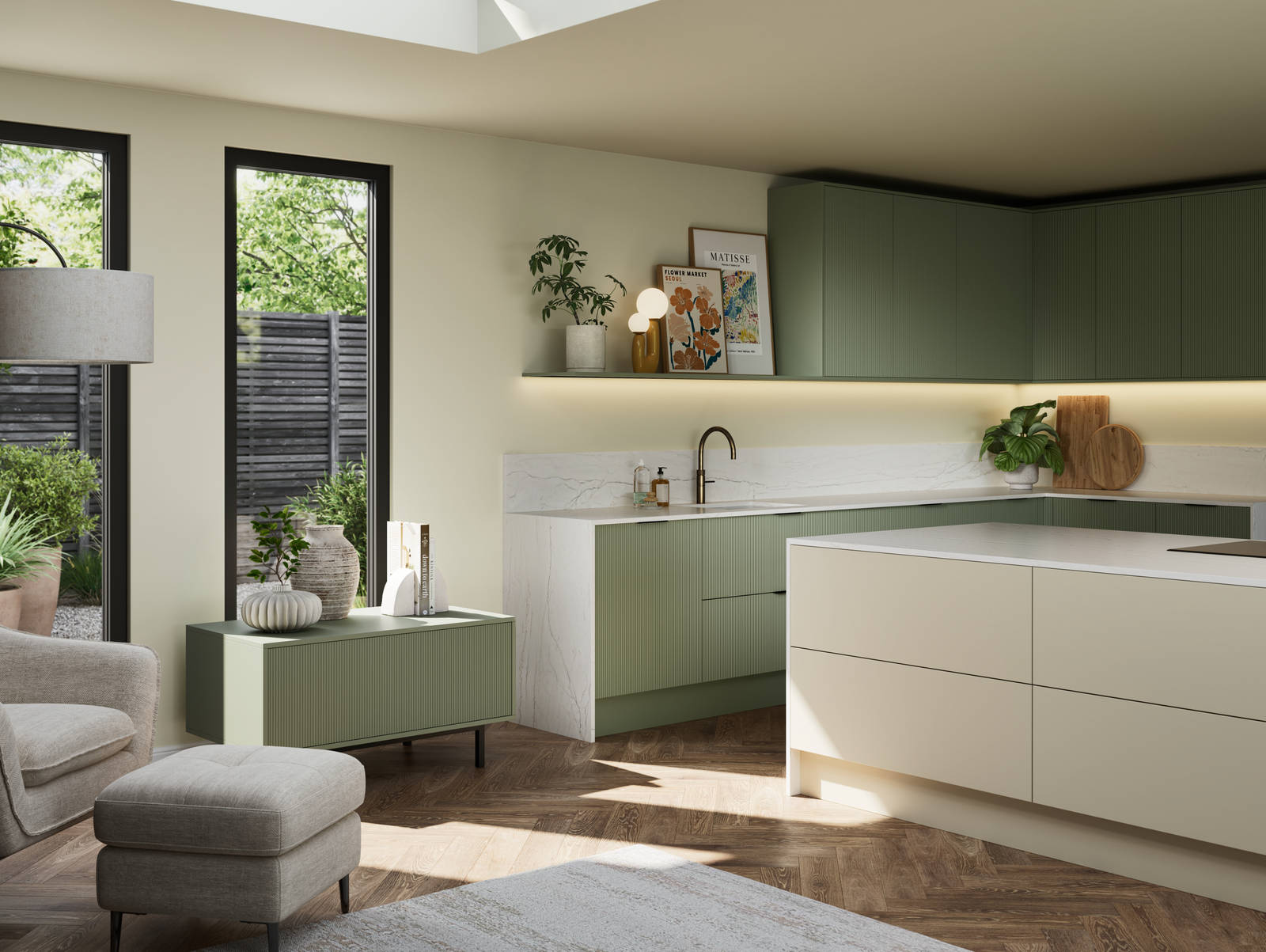 Green fluted kitchen fronts on tall cabinets with built-in appliances and black handles, light neutral shade handleless kitchen island and green sideboard on metal legs.