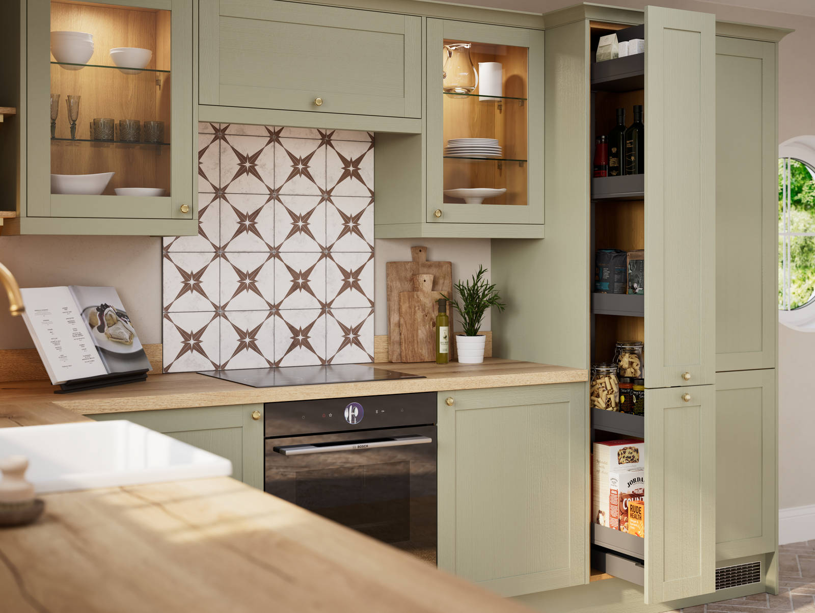 Opened pull-out larder in contemporary Shaker kitchen Ambleside from Magnet in sage green shade Meadow with belfast sink, aged taps and wooden effect worktop.