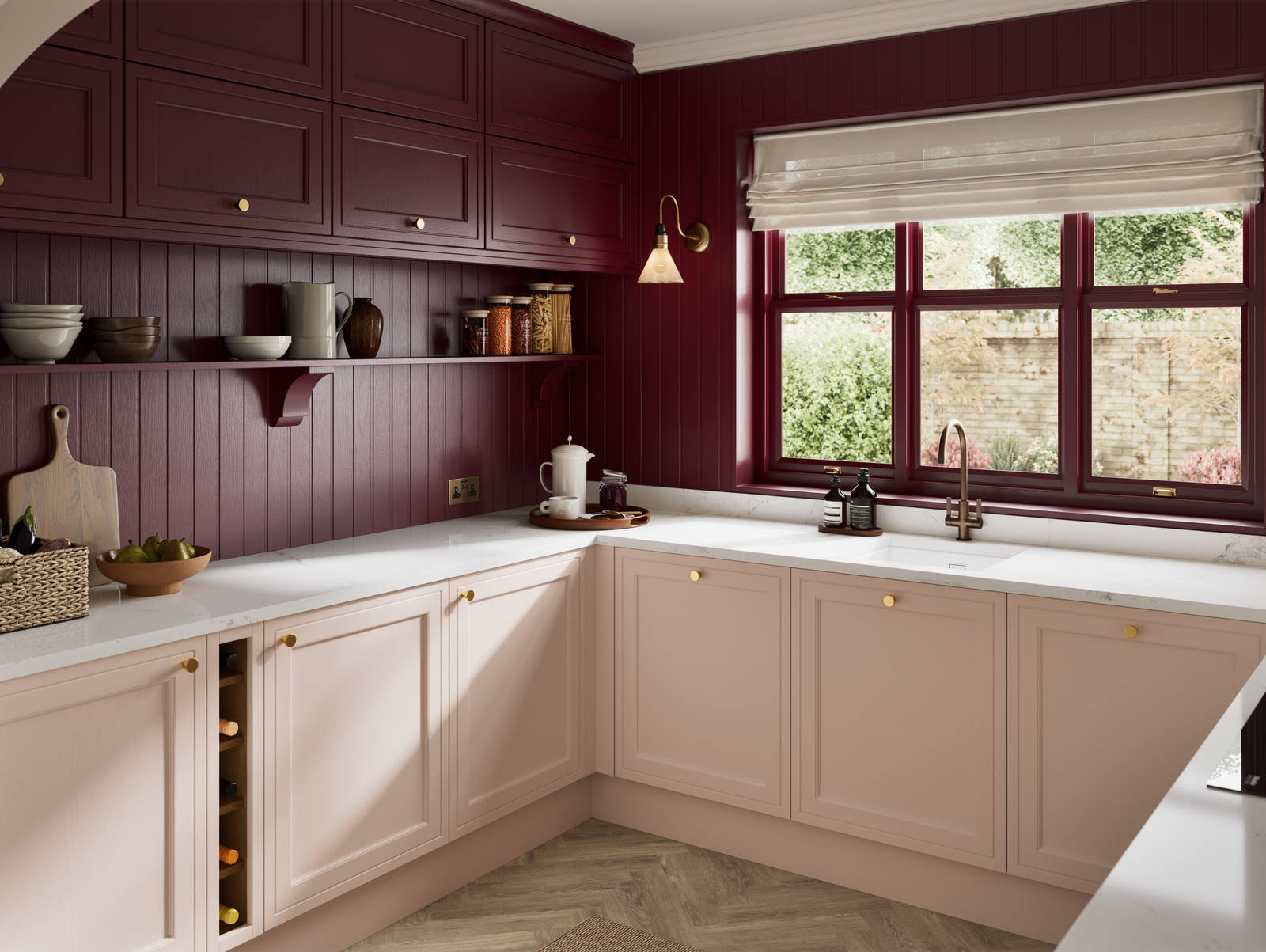 Painted wood grain Shaker style Bewdley kitchen with cabinets in light pink shade Chalk Blush, marbled worktop, brass knobs, red Morello wall-mounted cabinets with matching shelves and wall panel, built- in wine storage.