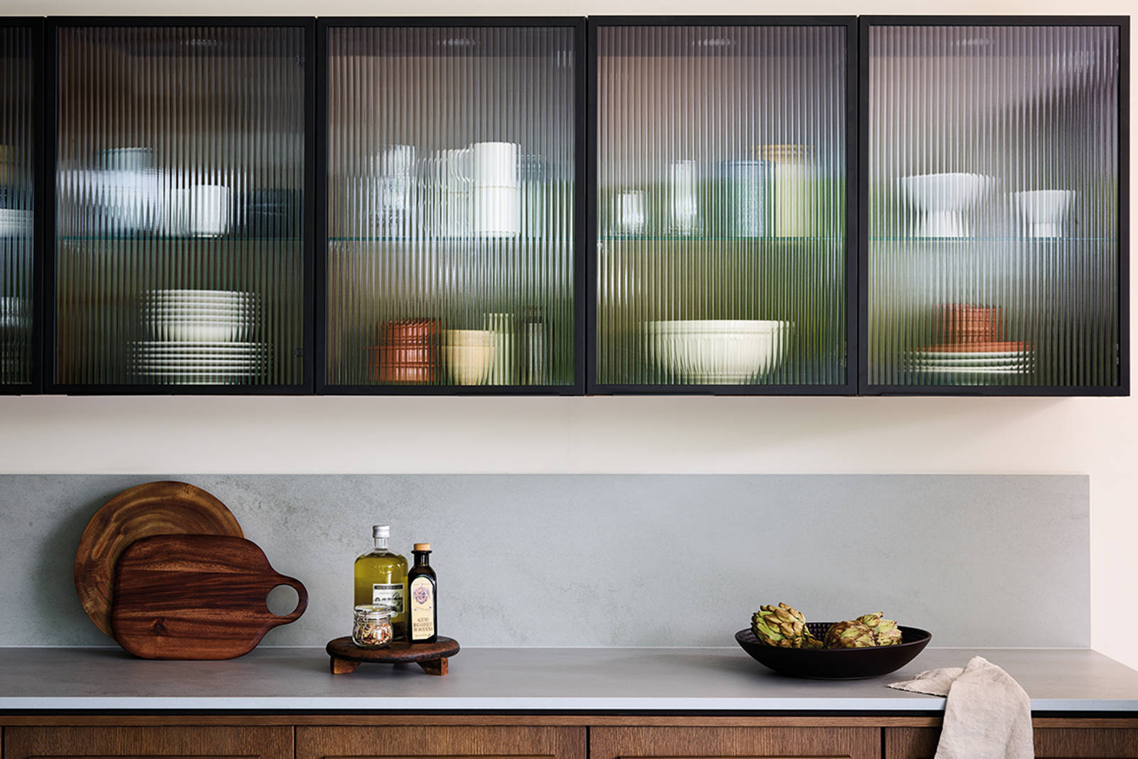 Nordic Nature. Modern wooden kitchen design with a Nordic influence. Featured floating worktops, a ribbed plinth and rounded end panels.