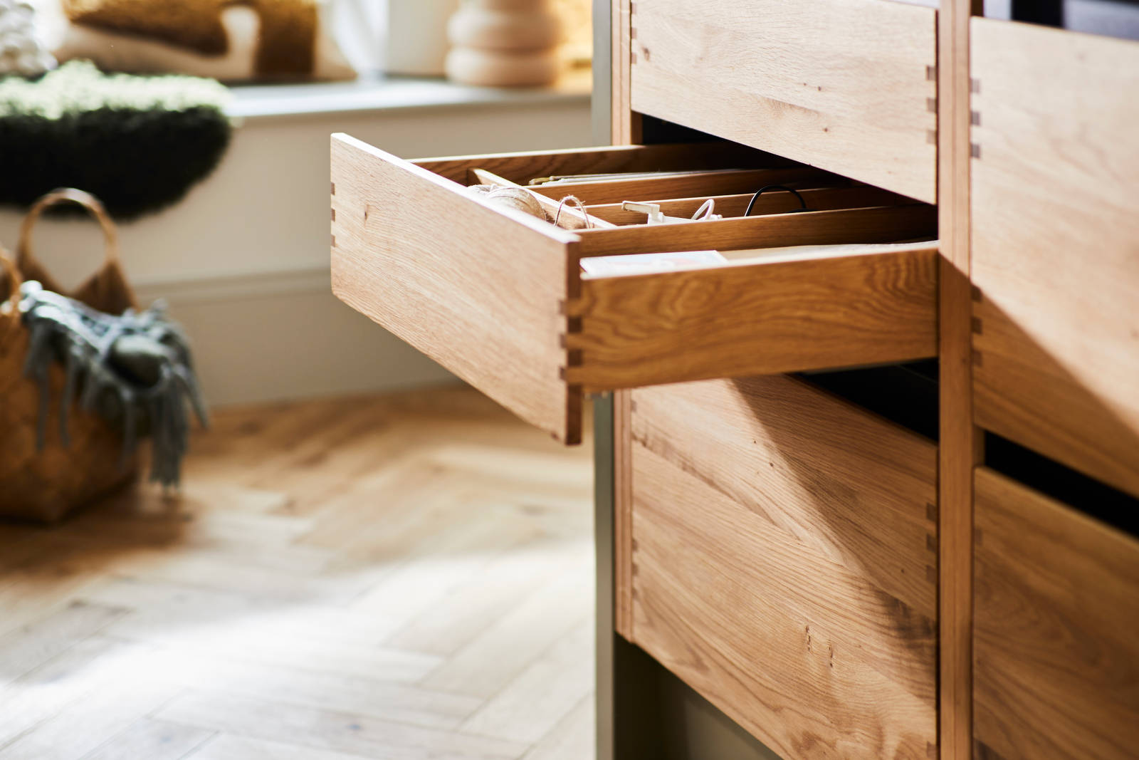 Opened oak drawer with oak inserts in Nordic Craft cabinetry in Jen Nash's kitchen.