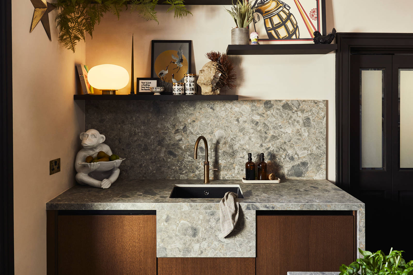 Sink area with Dekton in Ceppo backsplash and worktop, Nordic Nature cabinetry and a brass Quooker tap.