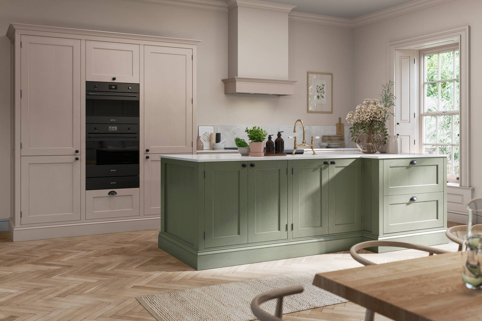 Open layout kitchen, a Thyme shade kitchen island and tall Wardley Shell cabinets with built-in ovens.