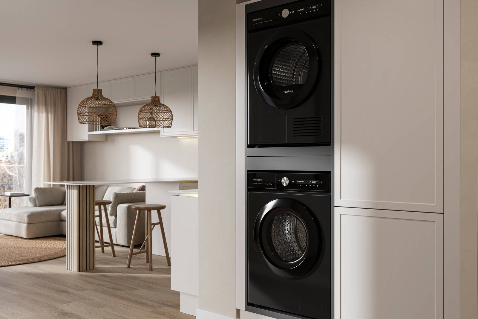 View from utility room with integrated washing machine and tumble dryer of handleless Wabi sabi inspired Integra Brunswick Limestone kitchen combined with living area, wood barstools for breakfast bar, natural materials, Euros oak flooring.