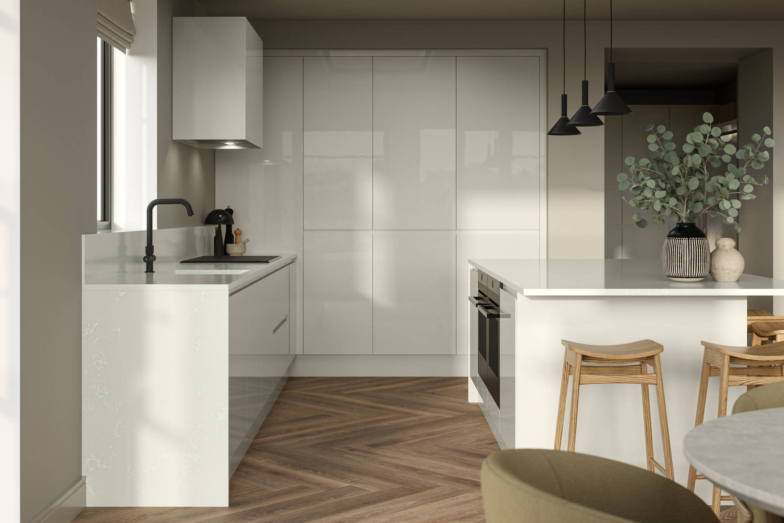 Corner of Luna Gloss Limestone kitchen with tall cabinets, kitchen island featuring an integrated oven, a breakfast bar with wood stools, a black tap and white extractor hood, Amtico smouldered oak in parquet flooring.