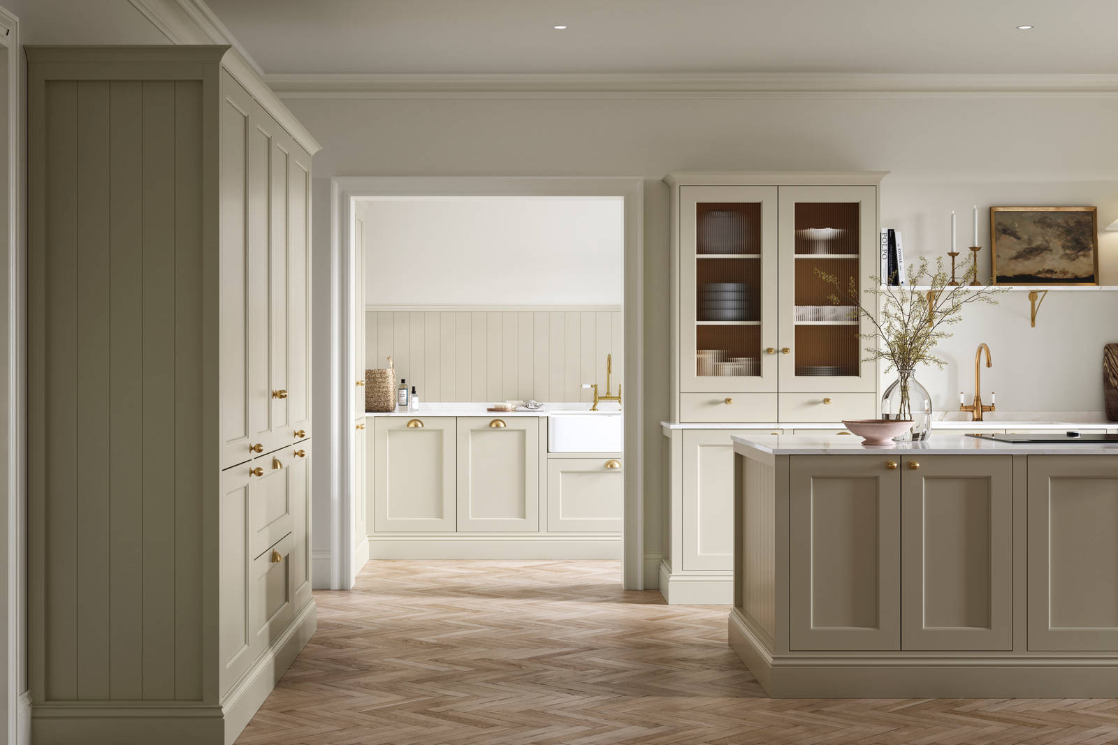 Open plan living room and Traditional Shaker-style kitchen Ludlow Parchment and view of utility room with white ceramic trough door frame, Goodrich Natural Oak herringbone engineered flooring, brass handles, brass knobs and bras tap.