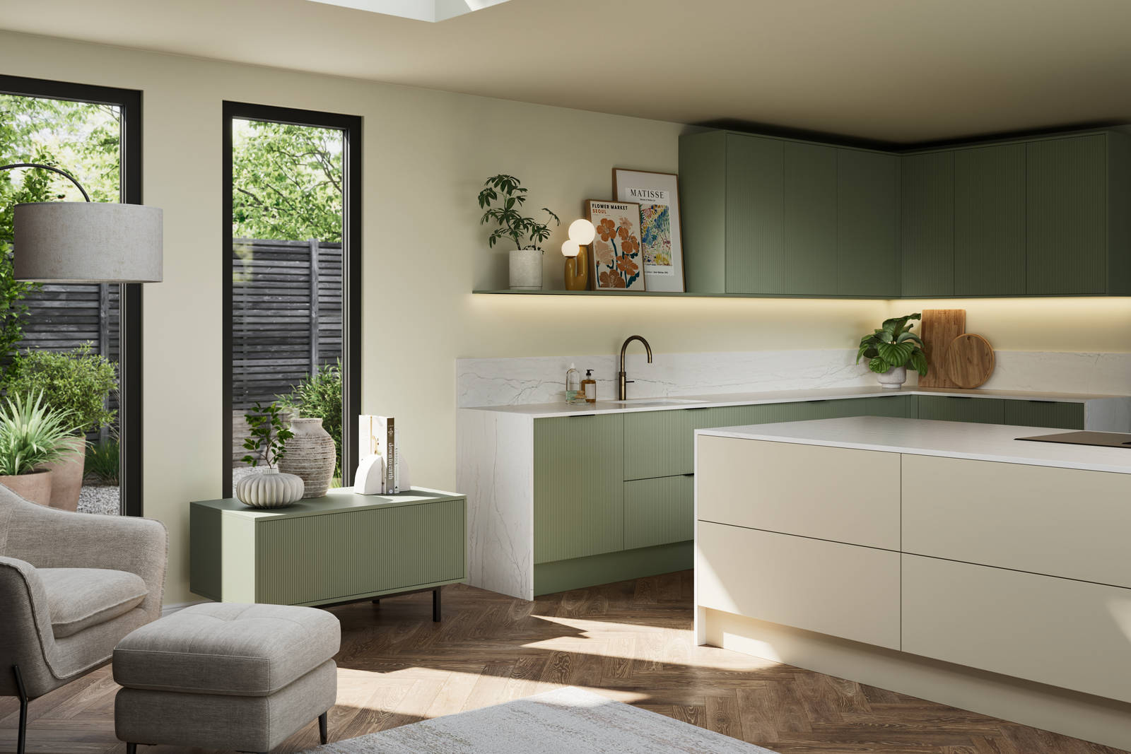 Green fluted kitchen fronts on tall cabinets with built-in appliances and black handles, light neutral shade handleless kitchen island and green sideboard on metal legs.