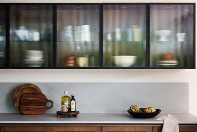 Nordic Nature. Modern wooden kitchen design with a Nordic influence. Featured floating worktops, a ribbed plinth and rounded end panels.