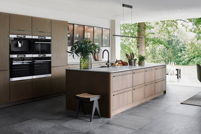 Nordic Nature. Modern wooden kitchen design with a Nordic influence. Featured floating worktops, a ribbed plinth and rounded end panels
