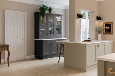 Ludlow kitchen, a Shaker door with a modern country-style in the neutral shade Pebble path paired with dark grey tall glass door display cabinets.