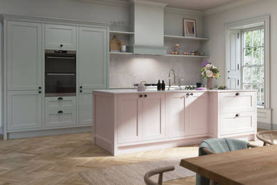 Ludlow, a traditional Shaker-style kitchen range featuring panelled doors with visible woodgrain and beading detail, in the light airy shade Seagrass.