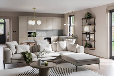 Open plan living room with Dunham kitchen in a creamy light shade.