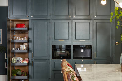 Ludlow, a traditional Shaker-style kitchen range in the shade Arboretum Green, kitchen larder.