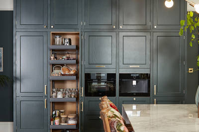 Ludlow, a traditional Shaker-style kitchen range in the shade Arboretum Green, kitchen larder.