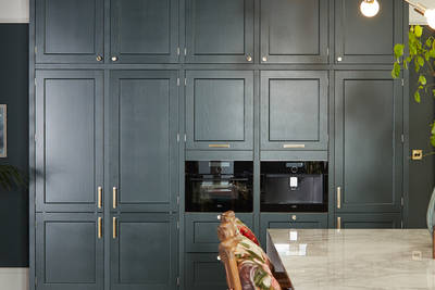 Ludlow, a traditional Shaker-style kitchen range in the shade Arboretum Green, tall cabinets