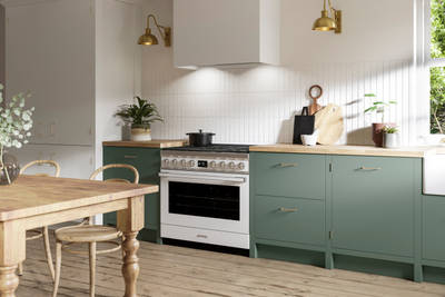 Soho Eucalyptus Green kitchen in charming contemporary cottage, a modern slab door with a painted rather than foil surface, for a truly premium look.