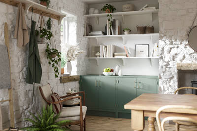 Living room in a charming contemporary cottage with Soho cabinetry in shade Eucalyptus green, a modern slab door with a painted rather than foil surface, for a truly premium look.