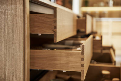 Close-up of opened oak drawers in Nordic Craft kitchen island.