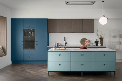 Soho Voyage Blue kitchen with fluted wood Nordic Nature wall cabinets and Soho Sky kitchen island, a premium painted slab front.