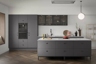 Soho Charcoals kitchen, a premium painted slab door from Magnet, with fluted glass Nordic Nature wall cabinets.