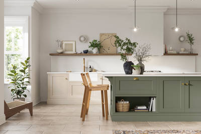 Traditional Shaker-style kitchen range in light shade Pebble path with a green Misty Moors kitchen island.