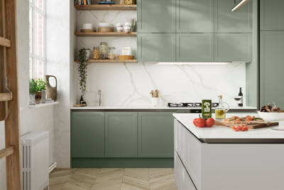 Integra Dunham from Magnet is a handleless shaker frontal, here shown in kitchen with kitchen island and wall cabinets in shades Eucalyptus and Washed Cotton, with a white marbled worktop and matching splashback with wood open wall shelves..