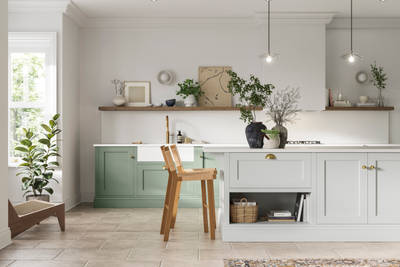 Traditional Shaker-style kitchen range in Eucalyptus Green with a light grey Fresh Linen shade kitchen island.
