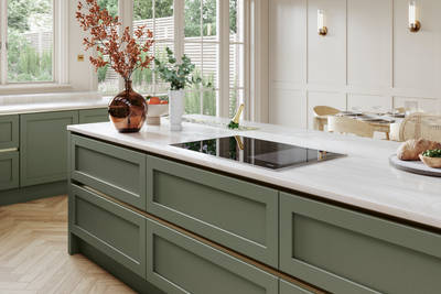 Kitchen island in Integra Wardley shade Misty Moor with narrow framing and integrated handles, on a painted timber finish.