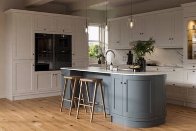 Traditional Shaker-style kitchen range featuring panelled doors with visible woodgrain and beading detail