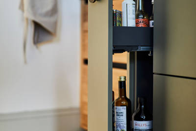 Modern slab Soho cabinets in the Balmoral colour, a soft beige green tone