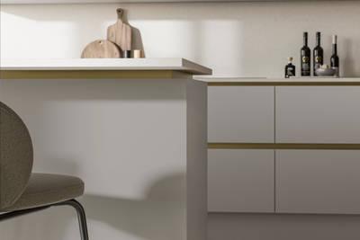 Modern and minimalist Integra Soho Dove Grey kitchen, a frameless slab door with integrated handles in a smooth paint finish.