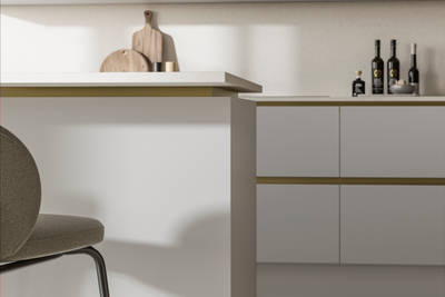 Modern and minimalist Integra Soho Fresh Linen kitchen, a frameless slab door with integrated handles in a smooth paint finish.