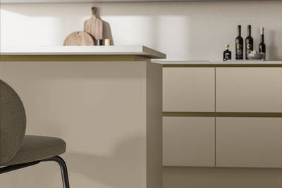 Modern and minimalist Integra Soho Pebble path kitchen, a frameless slab door with integrated handles in a smooth paint finish.