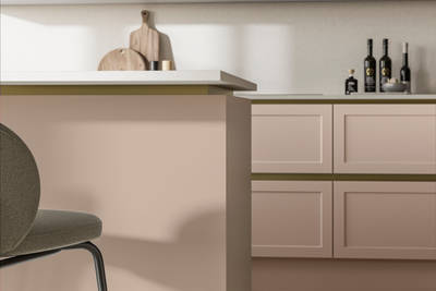 Integra Dunham Chalk Blush, a handleless shaker frontal with brass details and a white worktop..