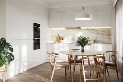 Handleless white gloss Luna kitchen from Magnet, light wood kitchen table with matching chairs and plants
