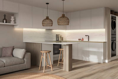 Handleless Wabi sabi inspired Integra Brunswick Limestone kitchen combined with living area, wood barstools for breakfast bar, natural materials, Euros oak flooring.