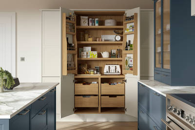 Opened larder with oak shelves and drawers in the modern Shaker kitchen Brunswick Voyage Blue and Limestone