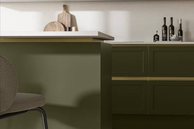 Integra Dunham Tailored Green, with brass details and a white worktop.