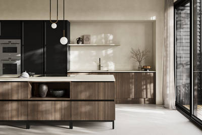 Handleless Integra Brunswick Sumi Black ultra-slim super-matt Shaker design and handleless rail system, with built-in ovens,  Portobello kitchen island and soft white marbled worktop and upstand, brushed brass tap.