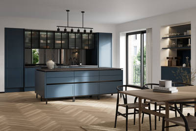 Handleless Integra Brunswick with an ultra-slim super-matt Shaker design and handleless rail system, in dark blue shade Voyage Blue, with black accessories and fluted glass wall cabinets, kitchen island